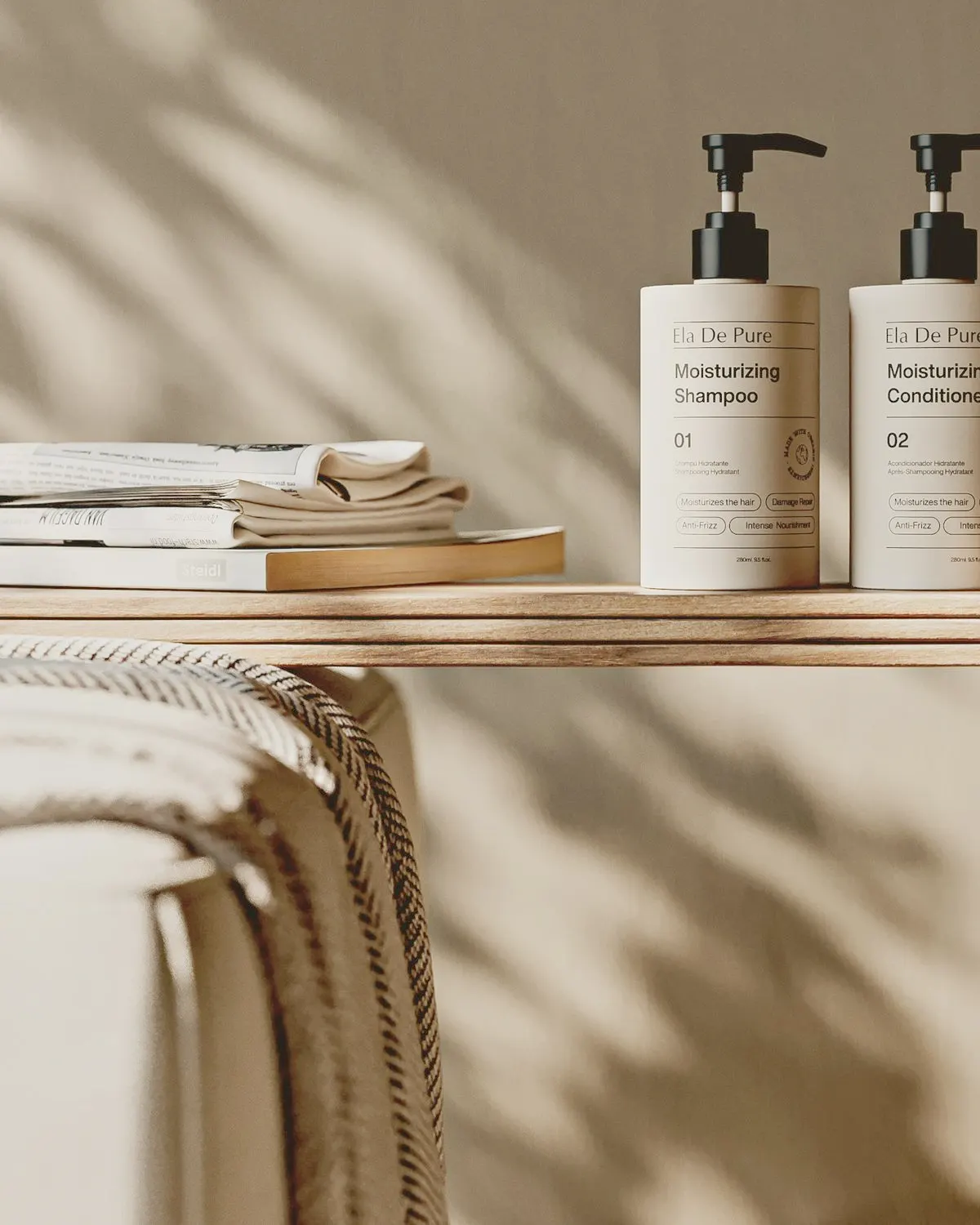 Shampoo and conditioner pump bottles on a wooden shelf